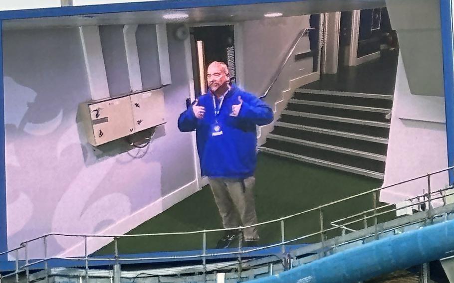 Stars and Stripes reporter Matthew Burke, wearing Leicester blue, appears on the big screen across Stamford Bridge on March 16, 2024, while lining up in the tunnel as the players do on match day. 