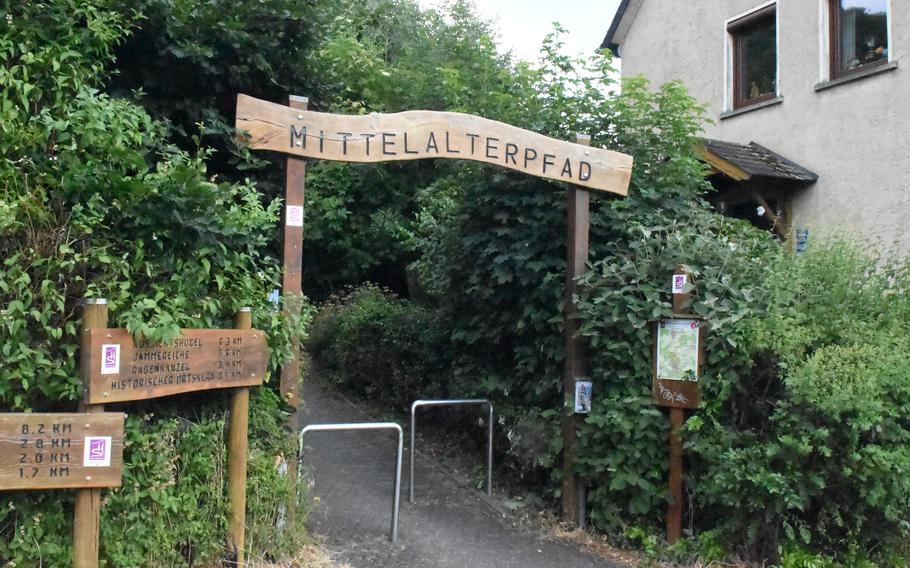 A sign marks the start of the Path of the Middle Ages, a 5.2-mile loop that starts in the historic medieval village of Herrstein, Germany.