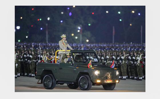 Senior Gen. Min Aung Hlaing, head of the military council, inspects officers during a parade to commemorate Myanmar's 79th Armed Forces Day, in Naypyitaw, Myanmar, Wednesday, March 27, 2024. 