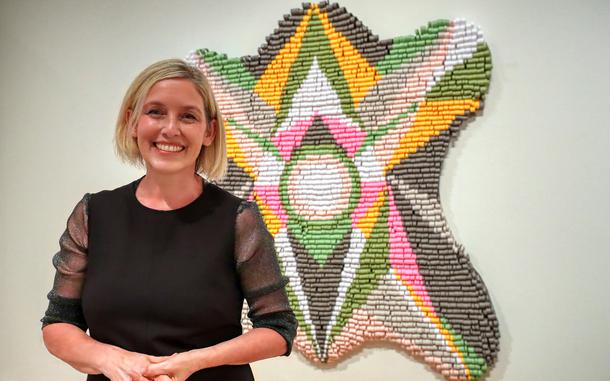 Artist Kelly Ladd and her self portrait. 