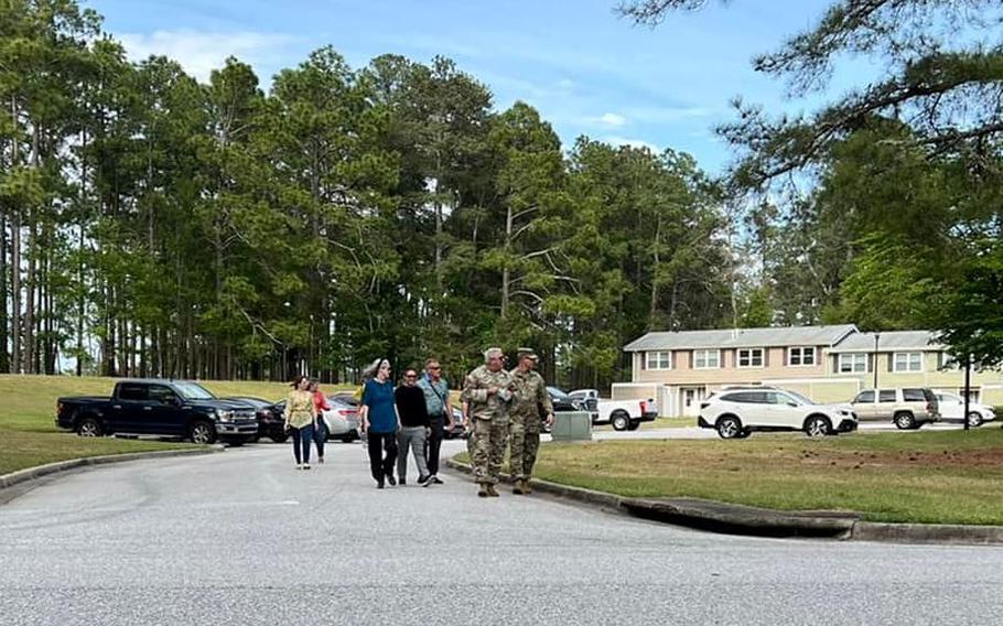 Fort Gordon Garrison Command leaders walk through the Georgia base’s family housing area earlier this month. Fort Gordon’s housing was the subject of a Senate report released Tuesday that found Balfour Beatty Communities, a private company that manages residences at the base, has mishandled maintenance requests and failed to properly clean homes between tenants.