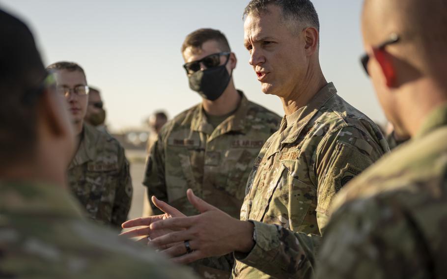 Air Force Lt. Gen. Alexus Grynkewich talks with airmen in September 2021 at an undisclosed location somewhere in Southwest Asia. 