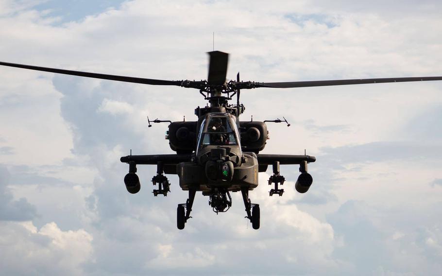 An AH-64 Apache attack helicopter with the 1st Cavalry Division Combat Aviation Brigade conducts training in September at Fort Hood, Texas. About 2,000 troopers from the brigade will deploy to Europe this fall for a nine-month training rotation with Operation Atlantic Resolve. 