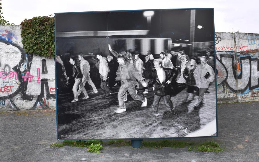 At Bösebrücke, where the Wall was first breached on the evening of November 9, 1989, an exhibit commemorates scenes of long-divided Berliners jubilantly greeting each other after nearly three decades of separation. 