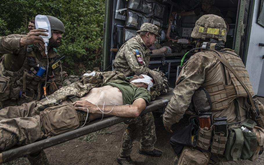 Wounded soldiers of the Ukrainian Airborne unit are treated outside the embattled city of Lysychansk, Ukraine on June 26, 2022. 