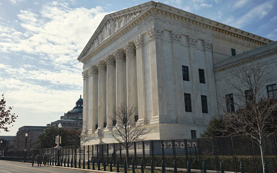 Soldiers with the New York National Guard patrol near the U.S. Supreme Court, Washington, D.C., Jan. 16, 2021. A draft Supreme Court decision that would overturn Roe v. Wade was recently leaked, not long after the Army and Air Force issued guidance that would prevent commanders from denying leave to service members seeking an abortion.