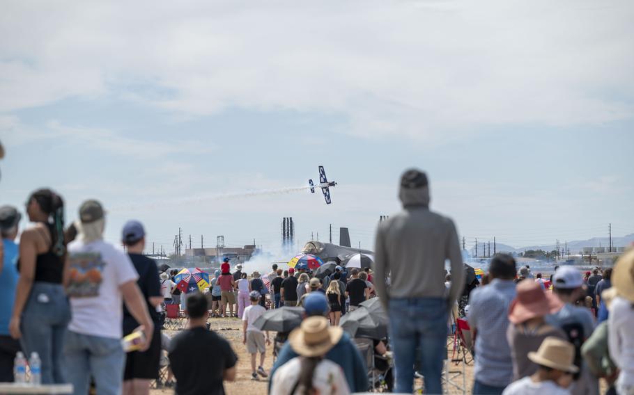 People watch aerial performances