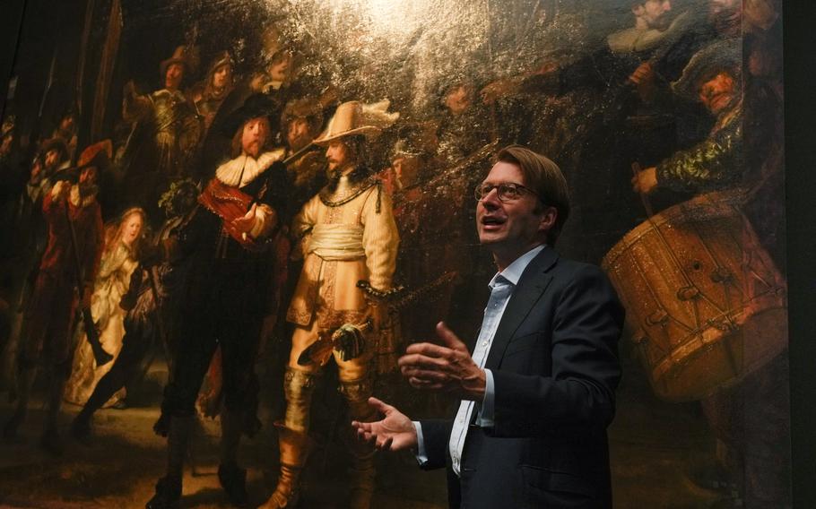 The added part of the painting is seen right as Rijksmuseum director Taco Dibbits explains how Rembrandt's biggest painting the Night Watch just got bigger with the help of artificial intelligence in Amsterdam, Netherlands, Wednesday, June 23, 2021. The Dutch national museum and art gallery reveals findings from a long-term project to examine in minute detail Rembrandt van Rijn's masterpiece the Night Watch. 