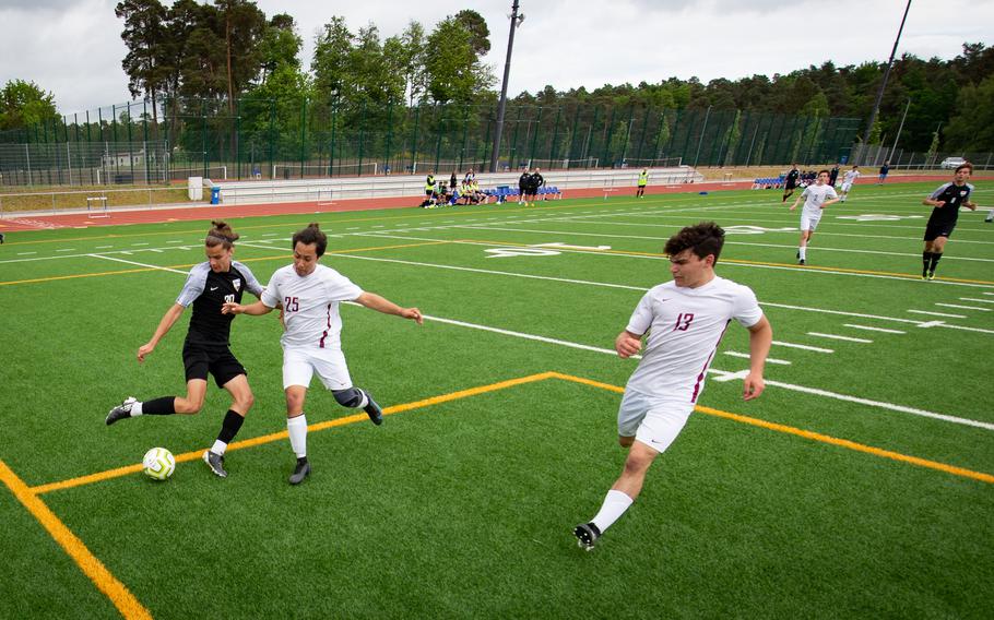 Stuttgart’s Itzak Sandoval battles Lakenheath’s Christian Chavira and Stephen Kofron in the penalty box during the DODEA-Europe Soccer Championships at Ramstein Air Base, Germany, May 16, 2022. The Stuttgart Panthers dominated the field against Lakenheath, scoring seven goals.