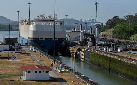 A ship is guided through the Panama Canal's Miraflores locks near Panama City on April 24, 2023. The scarcity of rainfall due to global warming has forced the Panama Canal to reduce the draft of ships passing through the interoceanic waterway, in the midst of a water supply crisis that threatens the future of this maritime route. (Luis Acosta/AFP/Getty Images/TNS)