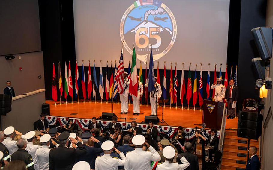 Sailors salute during a ceremony June 15, 2024, marking the 65th anniversary of Naval Air Station Sigonella on the Italian island of Sicily.