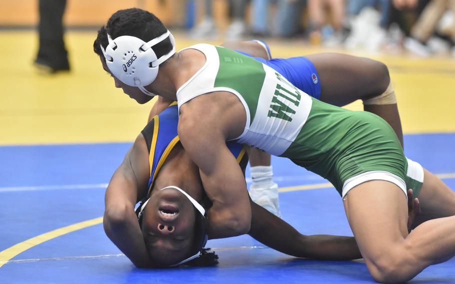 Sigonella’s Rickalia Goss tries to escape from Naples’ Joaquin Villescas in a 120-pound match at the DODEA European Wrestling Championships in Wiesbaden, Germany on Friday, Feb. 9, 2024.