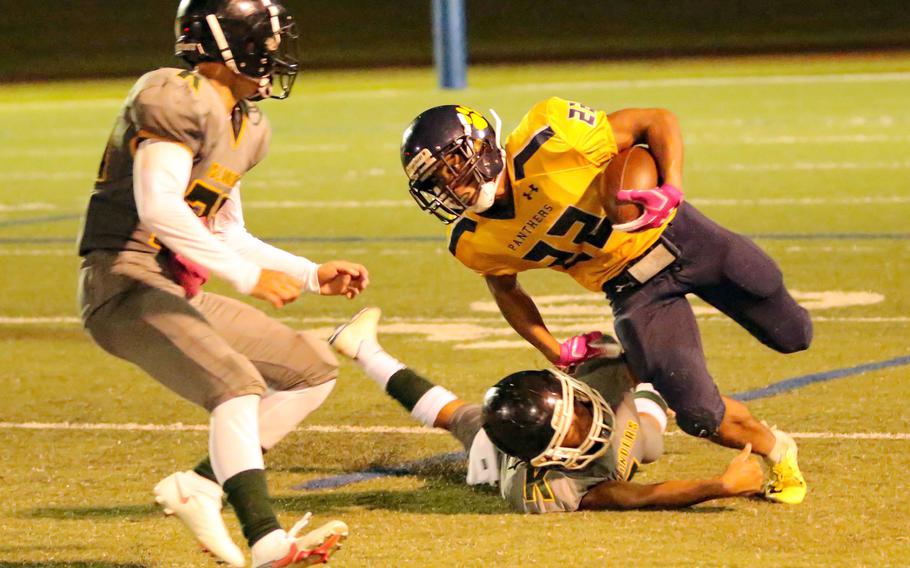 Guam High's DeShawn Baird lunges for several of his school-record 282 rushing yards.