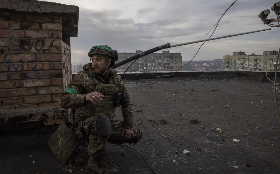 A Ukrainian junior sergeant with the call sign Bandit on top of a destroyed building on April 18, 2023. Ukrainian and Russian armed forces are fighting bloody battles in the ruined eastern city of Bakhmut. 