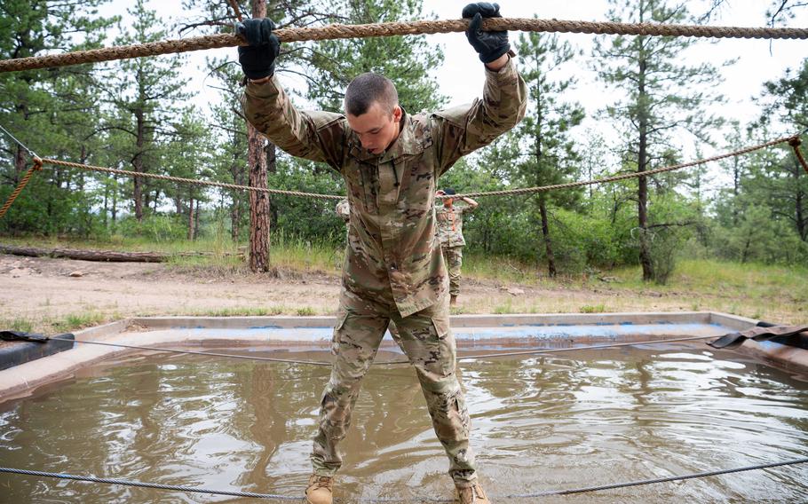 A cadet walks across water