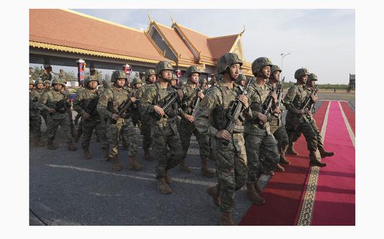 Chinese military personnel head to a field to participate in the Golden Dragon military exercise in Svay Chok village, Kampong Chhnang province, north of Phnom Penh Cambodia, Thursday, May 16, 2024. Cambodia and China on Thursday kicked off their annual Golden Dragon military exercise to strengthen cooperation and exchange military experiences. (AP Photo/Heng Sinith)