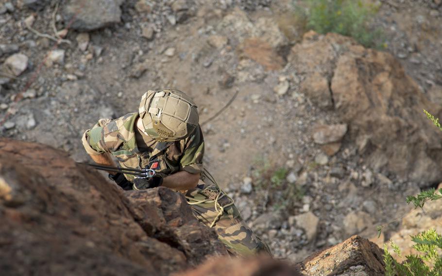 A French service member with the 5th Overseas Interarms Regiment rappels down a mountain at the Arta Range Complex, Djibouti, Dec. 15, 2021. 