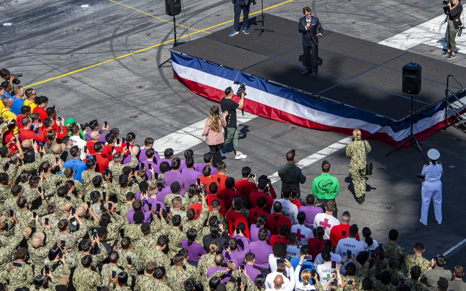 Tom Cruise addresses sailors on the USS Carl Vinson at Naval Air Station North Island, Calif., in May 2022 to mark the premiere of "Top Gun: Maverick." Shooting for Cruise's latest film again put the Navy in the big-screen spotlight, according to media reports.