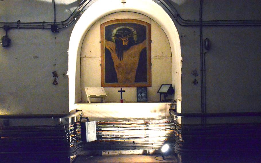 A depiction of Jesus Christ sits in a small alcove in one of the tunnels in Simserhof, a WWII fortification that was part of the Maginot Line in eastern France. 