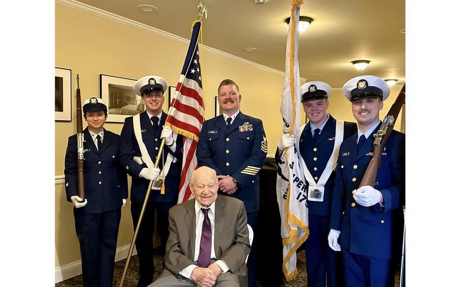Yannick Tagand, France’s General Counsel to the Midwest, on Tuesday, Jan. 30, 2024, presented France’s highest honor to D-Day veteran Dick Grout, pictured seated at center during the ceremony, for his part in France’s liberation in World War II.