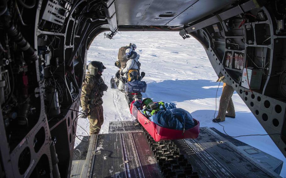Naval special warfare operators and Norwegian naval commandos exit an MH-47G Chinook helicopter Saturday, March 9, 2024, during an integration exercise designed to bolster skills in Arctic environments.