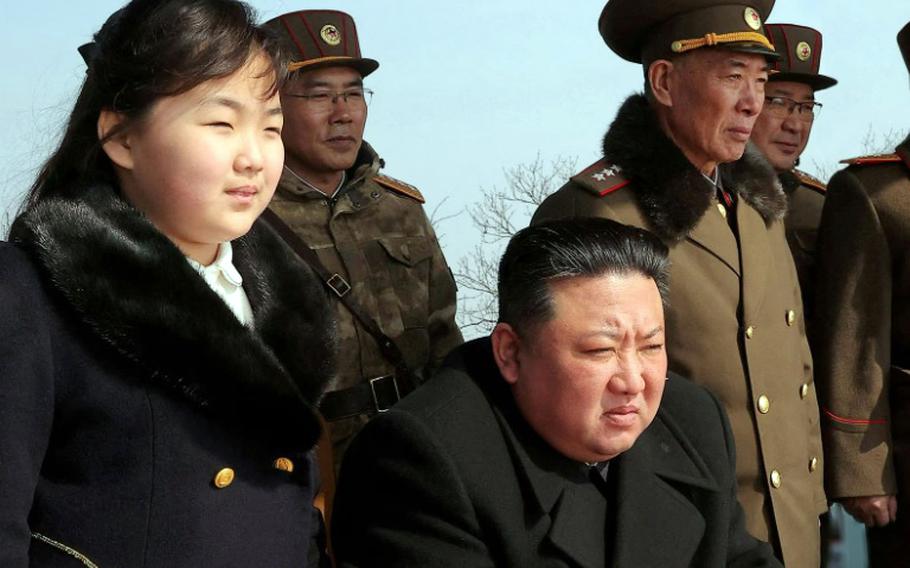 North Korean leader Kim Jong Un and his daughter observe a missile launch in this photo released by the state-run Korean Central News Agency on March 20, 2023. 