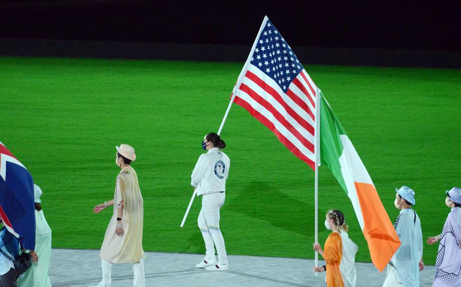 The American flag is carried into new National Stadium during the closing ceremony for the Tokyo Olympics, Sunday, Aug. 8, 2021. 