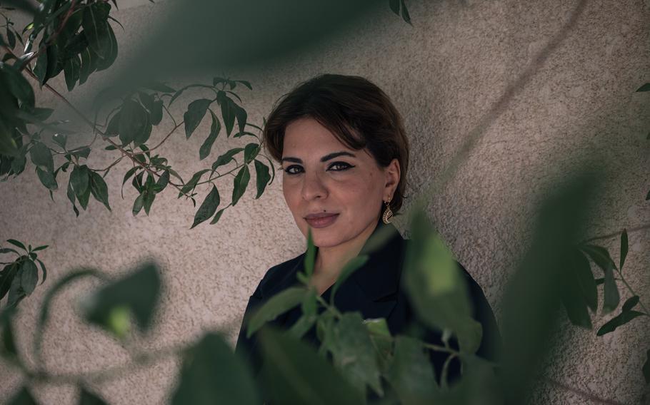 Enas Kareem, founder of Iraq’s only charity dedicated to helping drug users, poses for a portrait in Baghdad on Sept. 19.