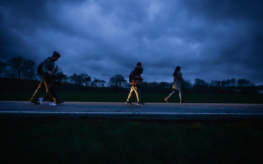 The Kai family leaves the scene of the accident, after a DODEA school bus tipped over Friday, March 10, 2023, near Weilerbach with 16 students on board. One student has been taken to Landstuhl Regional Medical Center with minor injuries, authorities at the Weilerbach firehouse said.