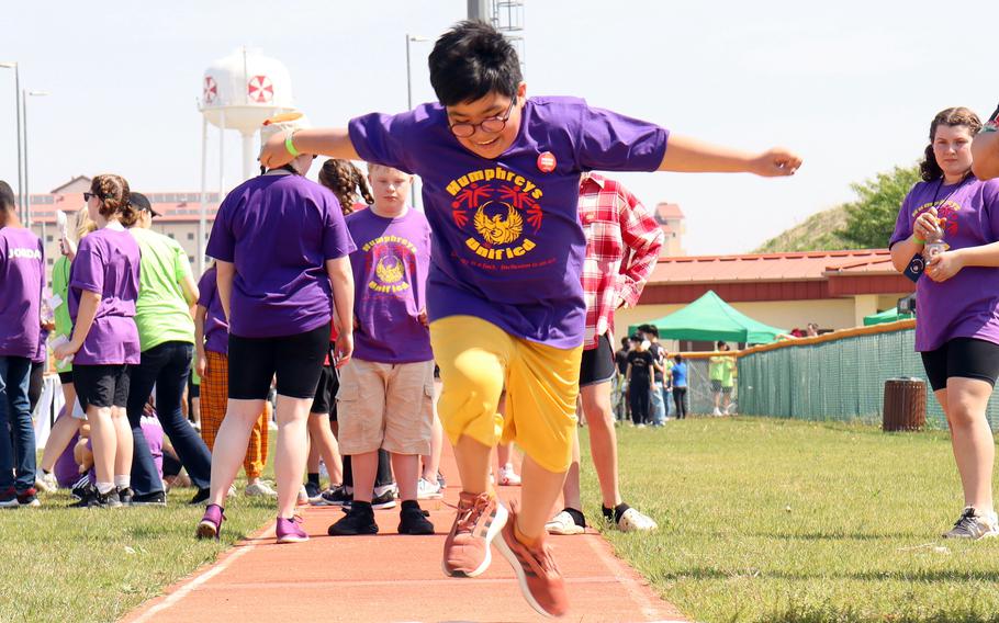 A student-athlete participates in the long-jump during the Unified Special Olympics at Camp Humphreys, South Korea, May 3, 2023.