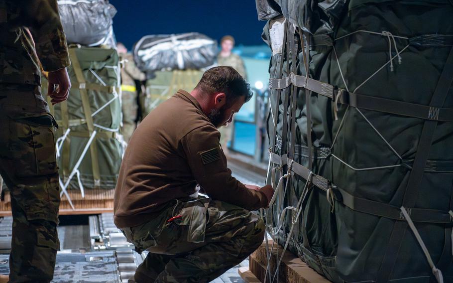 U.S. Air Force airmen and U.S. Army soldiers prepare bundles of humanitarian assistance for airdrop aboard a U.S. Air Force C-130J Super Hercules at an undisclosed location within the U.S. Central Command area of responsibility, Tuesday, March 5, 2024. 
