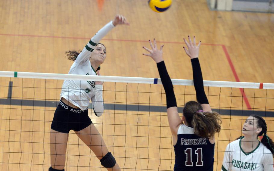 Kubasaki's Sophia Grubbs, spiking against Seisen's Ariana Hill, was named the tournament's Most Valuable Player.