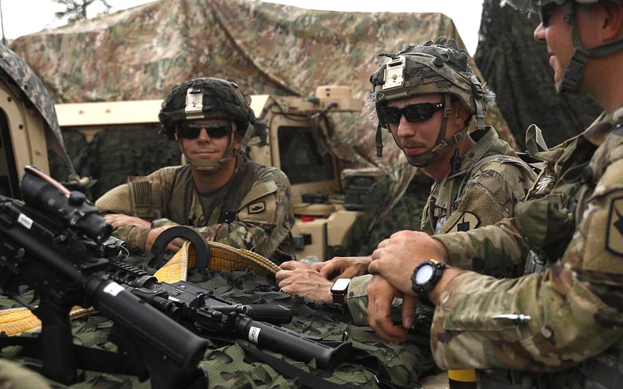 Spc. Jaden Clark, left, of the Nebraska Army National Guard’s 1-134th Cavalry Squadron stands with fellow Guardsmen at Fort Polk, La., in July 2021. Clark was named full-time rodeo coach at the Nebraska College of Technical Agriculture, where he is also an agricultural instructor.