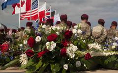 Members of the 82nd Airborne Division stand in front of a wreath during a ceremony on Sept. 20, 2021, in Nijmegen, Netherlands, to remember the 48 U.S. soldiers who died crossing the Waal River 77 years ago during Operation Market Garden in World War II.