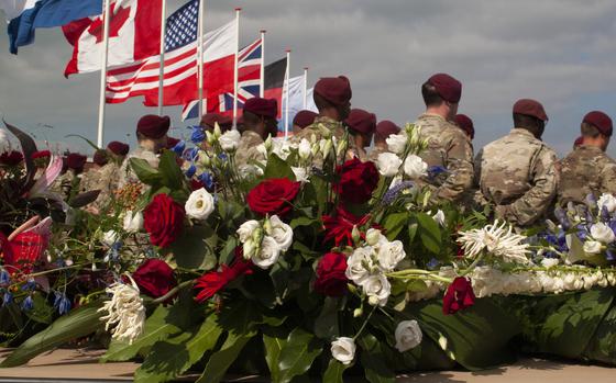 Members of the 82nd Airborne Division stand in front of a wreath during a ceremony on Sept. 20, 2021, in Nijmegen, Netherlands, to remember the 48 U.S. soldiers who died crossing the Waal River 77 years ago during Operation Market Garden in World War II.