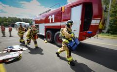 Firefighters assigned to the 86th Civil Engineer Group respond to a real medical emergency call involving an unconscious base employee at Ramstein Air Base, Germany, July 26, 2022. The first responders answered the emergency call in the midst of an ongoing simulated aircraft crash exercise scenario.