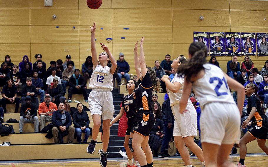 Warrior Angelica Shea goes up on a drive during a home game against Spangdahlem on Jan. 19, 2024, at Wiesbaden High School in Wiesbaden, Germany.