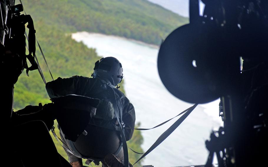 A C-130J Super Hercules crewmember confirms that crates filled with Operation Christmas Drop supplies were delivered to islanders in the Federated States of Micronesia, Wednesday, Dec. 7, 2022. 