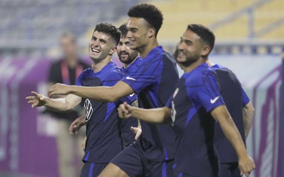 United States forward Christian Pulisic, left, and other players participate in an official training session at Al-Gharafa SC Stadium, in Doha, Saturday, Nov. 19, 2022.