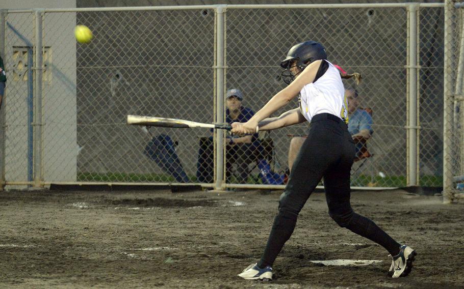 Kadena junior shortstop Morgan Sayers belts a walk-off triple to left field, driving in Lia Connolly and Janna Hurst with the game-winning runs Tuesday in the Panthers' 5-3 win over Kubasaki in an Okinawa softball game.