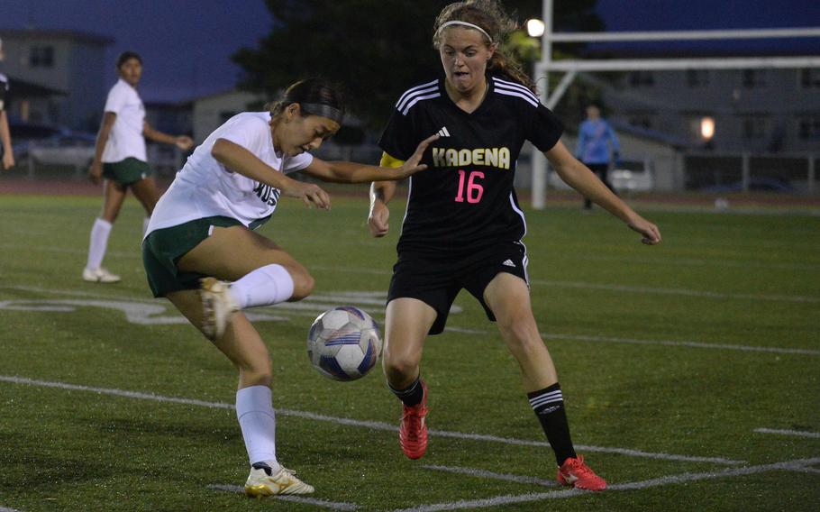 Kubasaki's Sakura Lopez gets set to boot the ball against Kadena's Marina Sawyer during Wednesday's DODEA-Okinawa girls soccer match. The teams played to a 1-1 draw.