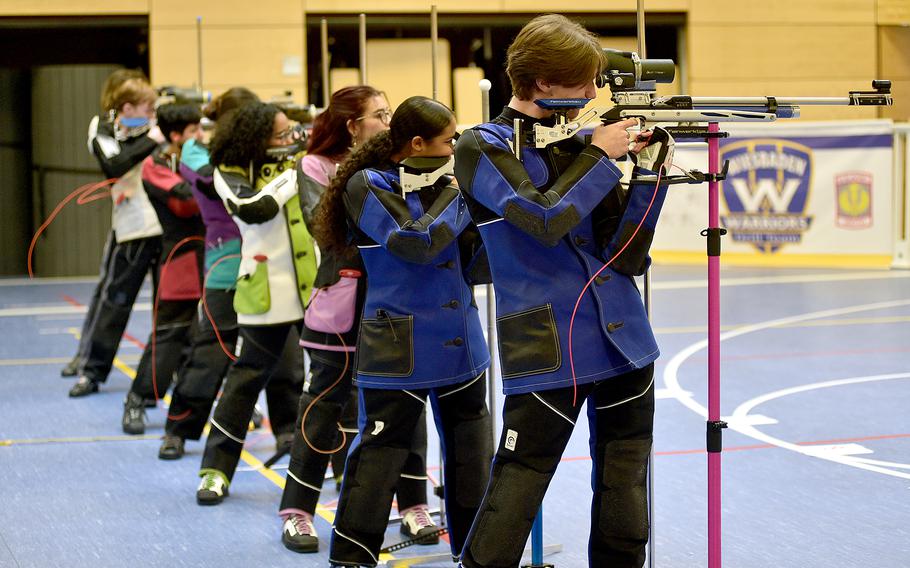 The top eight individuals compete in the final shootout during the DODEA European marksmanship championship on Saturday at Wiesbaden High School in Wiesbaden, Germany. Aiming, from right, are Ansbach's Alexander Pohlman and Kalea Russell, Stuttgart's Leila Ybarra and Nole Smith, Kaiserslautern's Katelynn McEntee, Vilseck's Adelena Lavarez and Wiesbaden's Mathew Hise and Cydnee Lassiter.