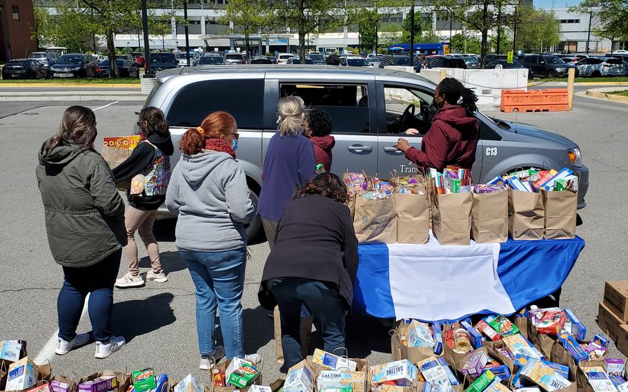 Members of Blue Star Families participate in a food drive benefiting military families in May 2021 at the Bronx Veterans Affairs Medical Center in New York. The organization provides food drives for military and veteran families in need. Similar needs exist in Europe, where military families receive federal vouchers to buy food. 