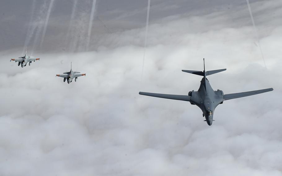 Egyptian F-16 Fighting Falcons form off the wing of a U.S. Air Force B-1B Lancer during a patrol above Egypt, Oct. 30, 2021. The U.S. Air Force needs to focus more on North Africa, particularly as Russia seeks to grow its influence in Libya, a Rand Corp. report said.