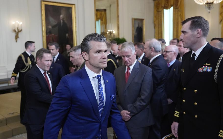 Defense Secretary Pete Hegseth departs a trophy presentation.