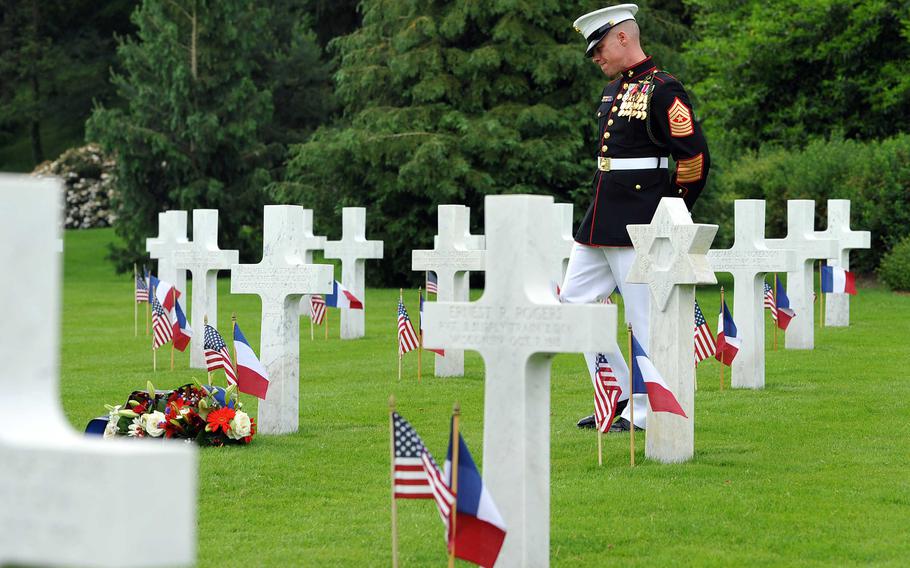 Marine Sgt. Maj. Darrell Carver, 6th Marine Regiment, walks through the graves at Aisne-Marne American Cemetery in Belleau, France, during the Memorial Day ceremony there in 2017.