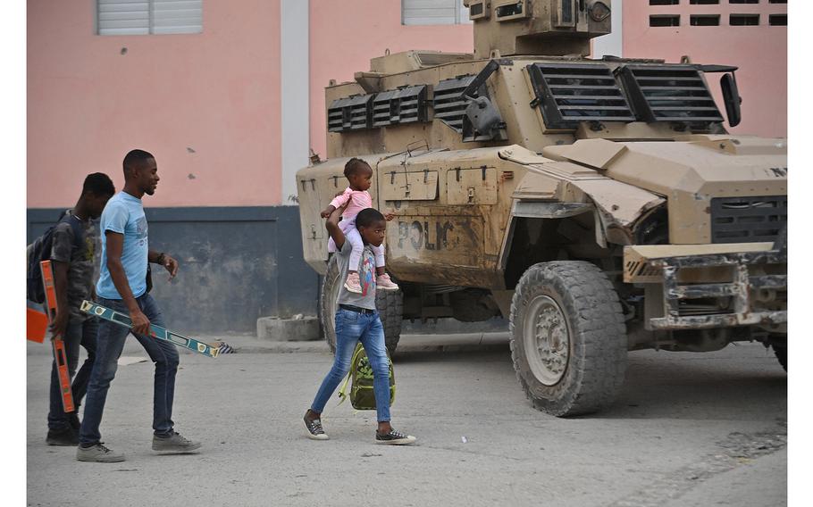 People flee gang violence in the Petion-Ville neighborhood of Port-au-Prince, Haiti, on Jan. 30, 2024.