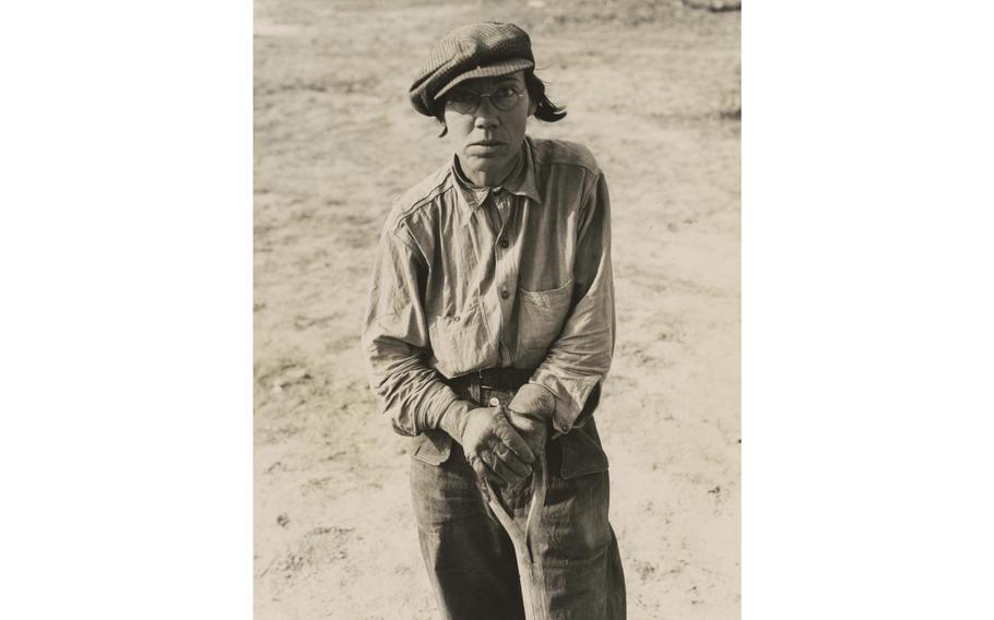 Dorothea Lange’s “Calipatria (vicinity), California. Native of Indiana in a migratory labor contractor’s camp. ‘It’s root hog or die for us folks.’,” February 1937, gelatin silver print.