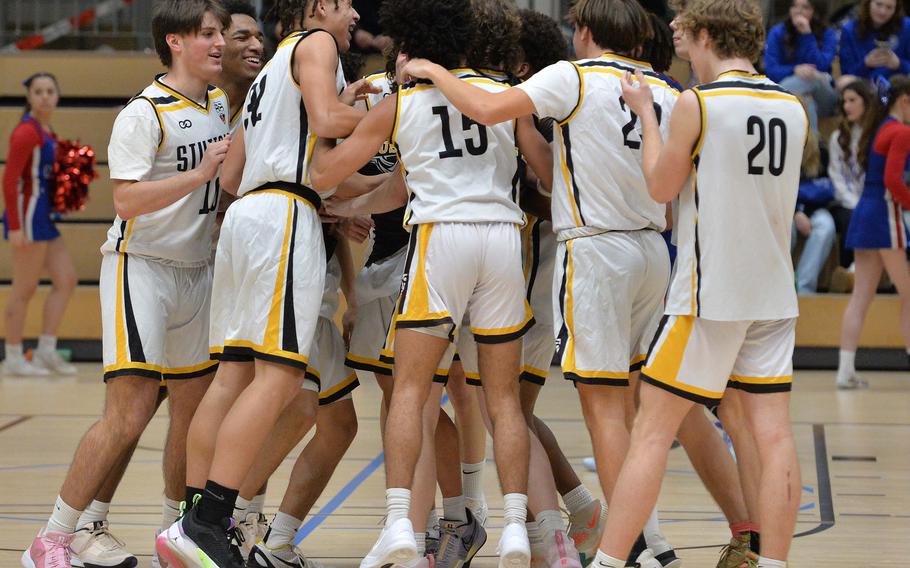 The Stuttgart Panthers celebrate after defeating Ramstein 47-36 to win the Division I title at the DODEA-Europe basketball championships in Wiesbaden, Germany, Feb. 17, 2024. 