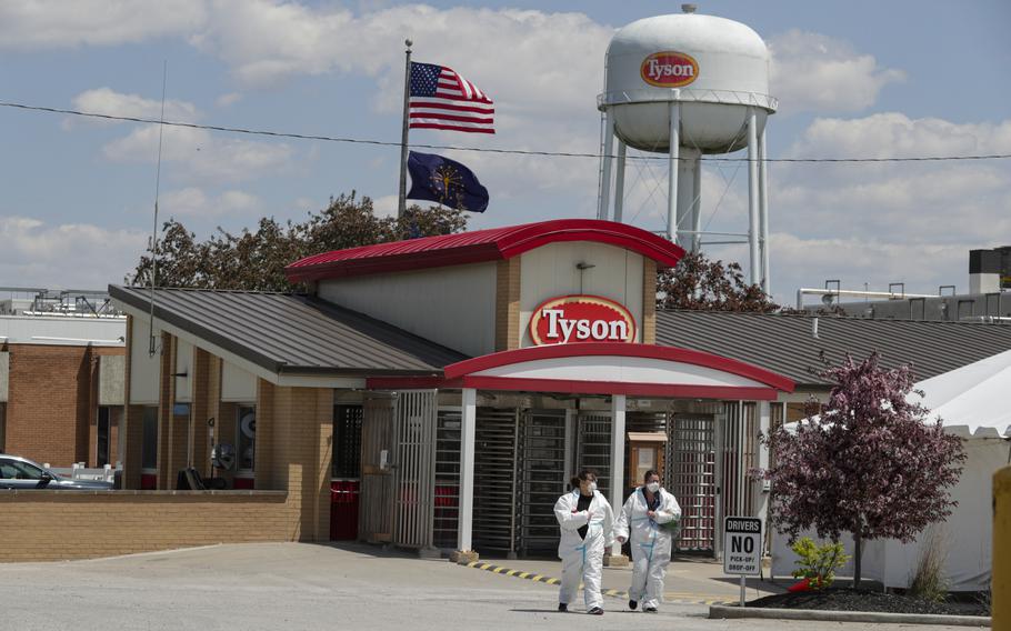 In this May 7, 2020, photo, workers leave the Tyson Foods pork processing plant in Logansport, Ind. At the height of the pandemic, the meat processing industry worked closely with political appointees in the Trump administration to stave off health restrictions and keep processing plants open even as COVID-19 spread rapidly among workers, according to a new Congressional report released Thursday, May 12, 2022. 